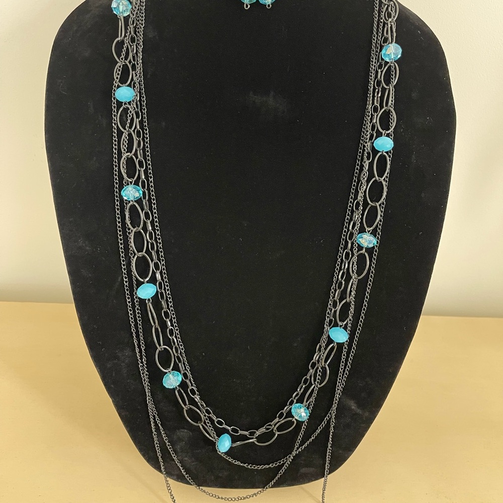 necklace and earrings with light blue bead